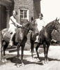 Jean and Jeanette on horseback in rear of Grandpa Frost's house in Fredonia